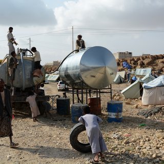 Water is being trucked into a displacement camp where about 200 muhamasheen families, displaced from Sa’ada, live.