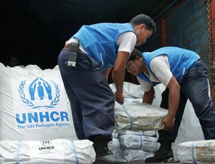 UNHCR Staff Load Shelter Supplies for Cyclone Survivors